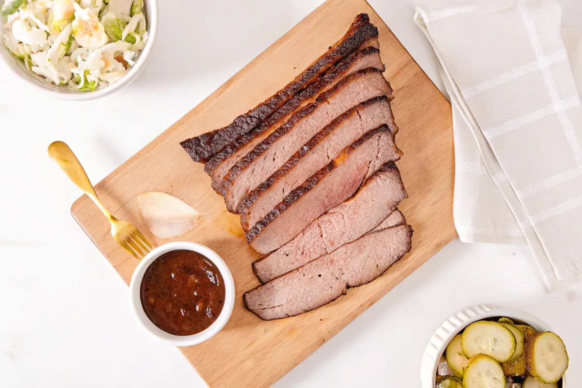 Traeger-smoked brisket served with BBQ sauce